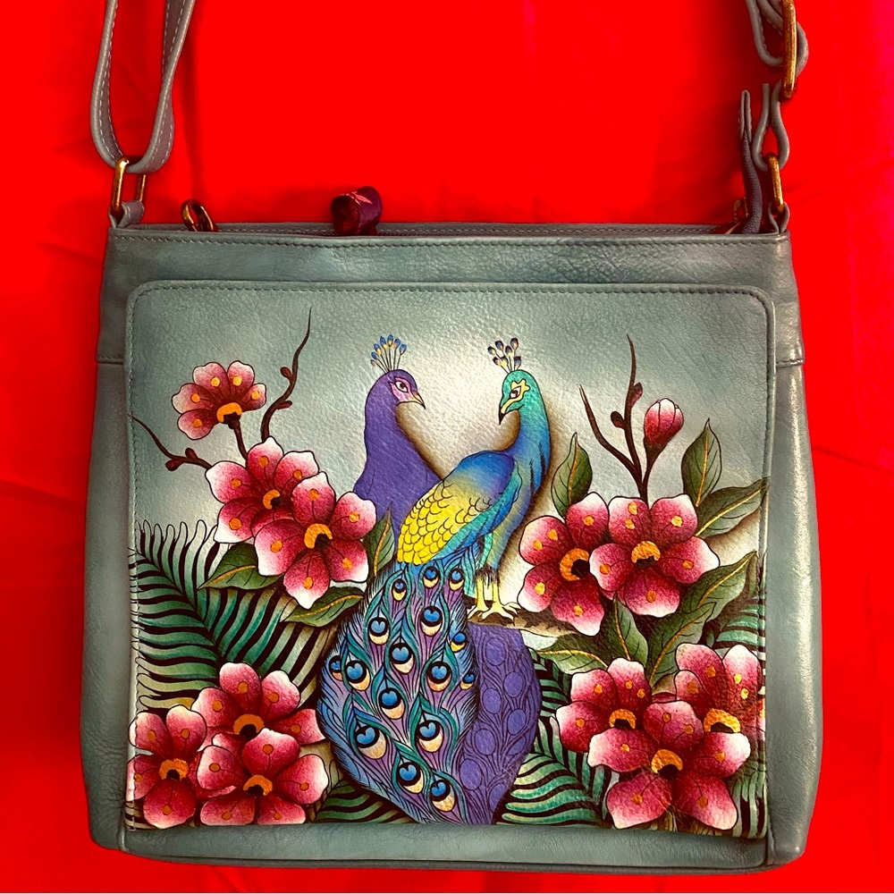 Beautiful turquoise ANUSCHKA bag never used has a lot of pockets .